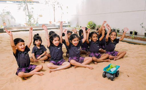 Ekya Early Years Students playing in the soil