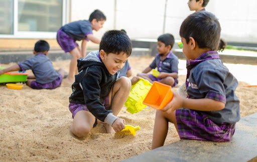 Best Preschool in Bangalore, Ekya Early Years Students playing in soil